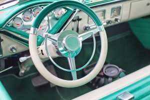 Classic 1950s car dashboard with turquoise interior